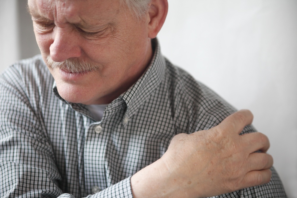 man that needs treatment for shoulder pain