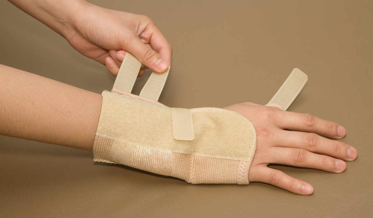 Person putting on a carpal tunnel wrist brace