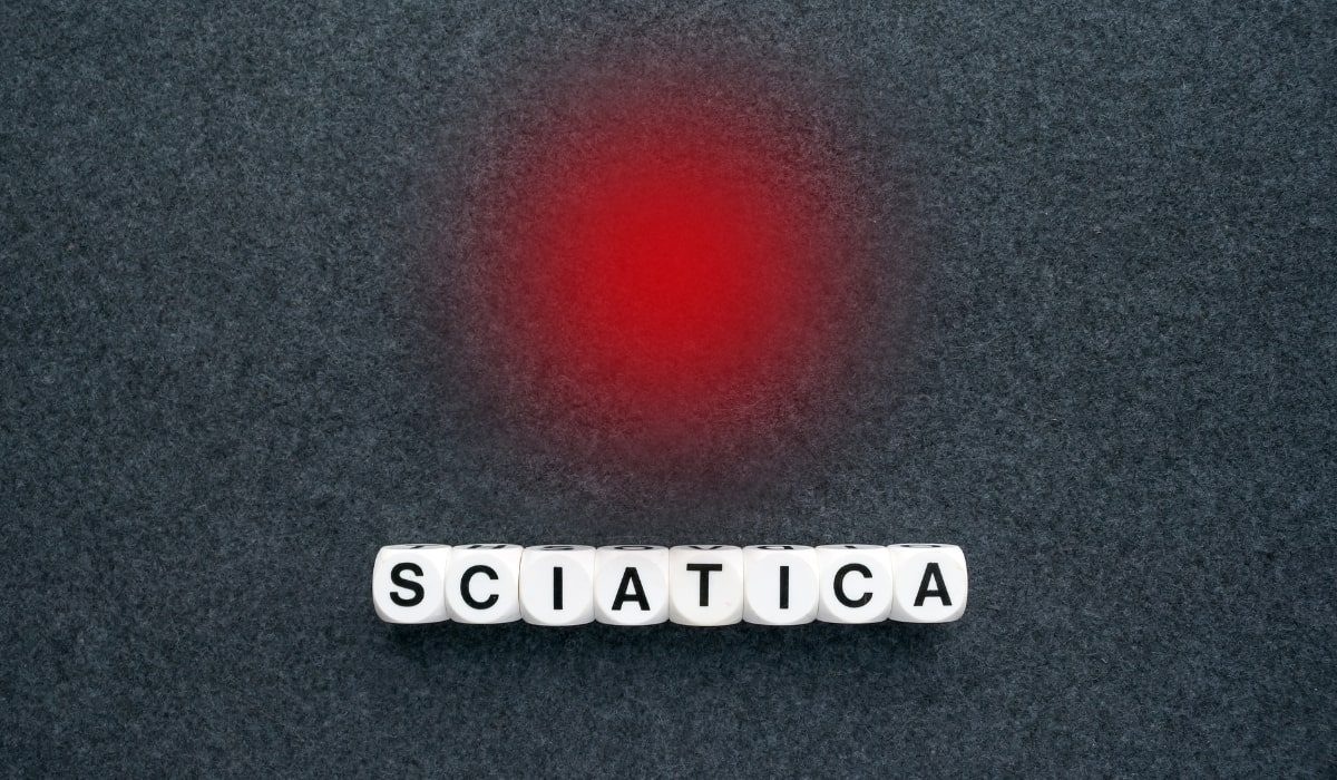 Red Dot with word dice under it spelling sciatica