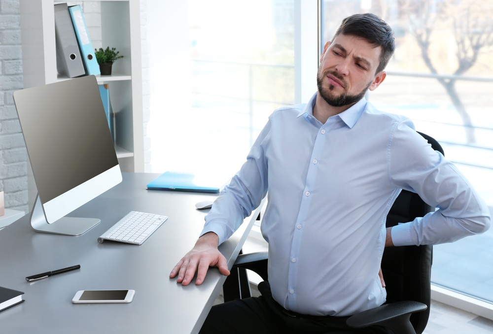 man experiencing back pain