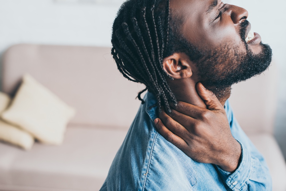 someone experiencing neck pain
